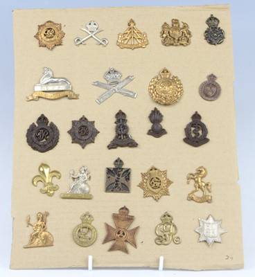 Lot 297 - A collection of cap and collar badges, to...