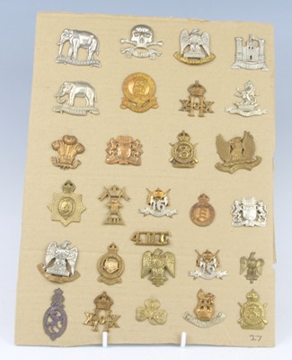 Lot 41 - A collection of cap badges and insignia, to...