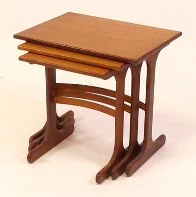 Lot 780 - A 1960s G-plan teak nest of three occasional...