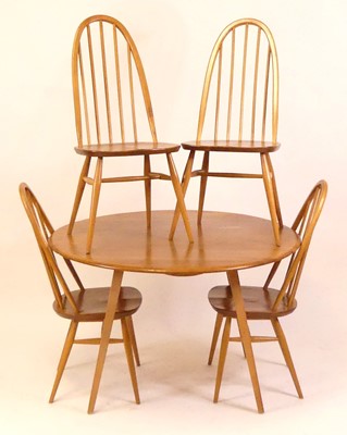 Lot 794 - A 1960s Ercol blond elm breakfast suite,...