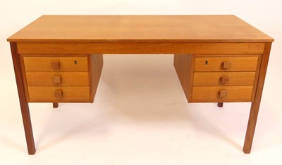 Lot 807 - A 1960s Danish teak kneehole writing desk,...