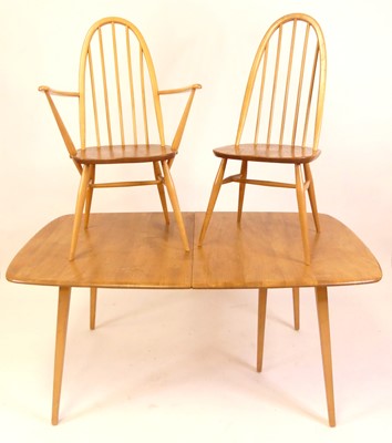 Lot 800 - An Ercol blond elm dining suite, comprising;...