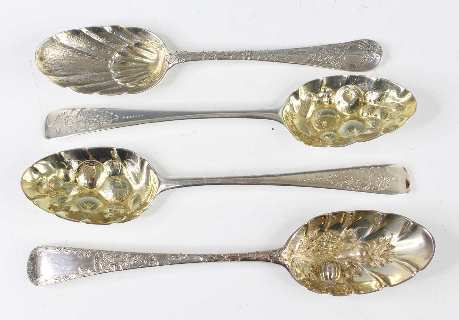 Lot 2066 - A pair of George III silver berry spoons, each...