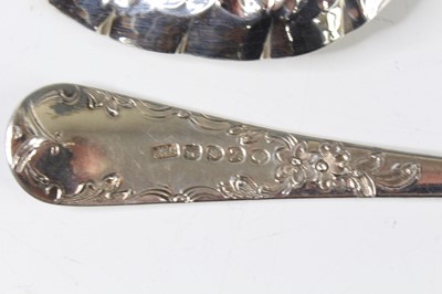 Lot 2066 - A pair of George III silver berry spoons, each...