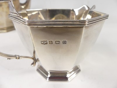 Lot 573 - An Art Deco silver three-piece tea set by...