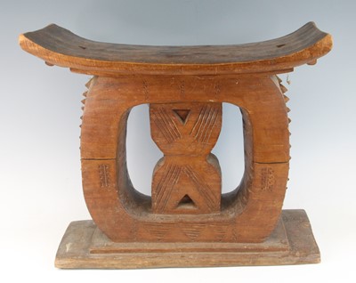 Lot 2287 - A large carved hardwood "Elders" type stool,...