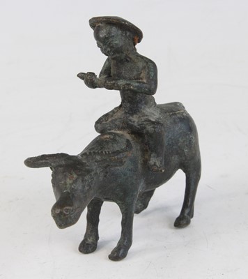 Lot 2278 - A Chinese bronze figure, modelled as a...