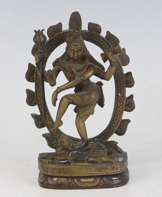 Lot 2280 - An Indian brass figure of Shiva Nataraja, the...