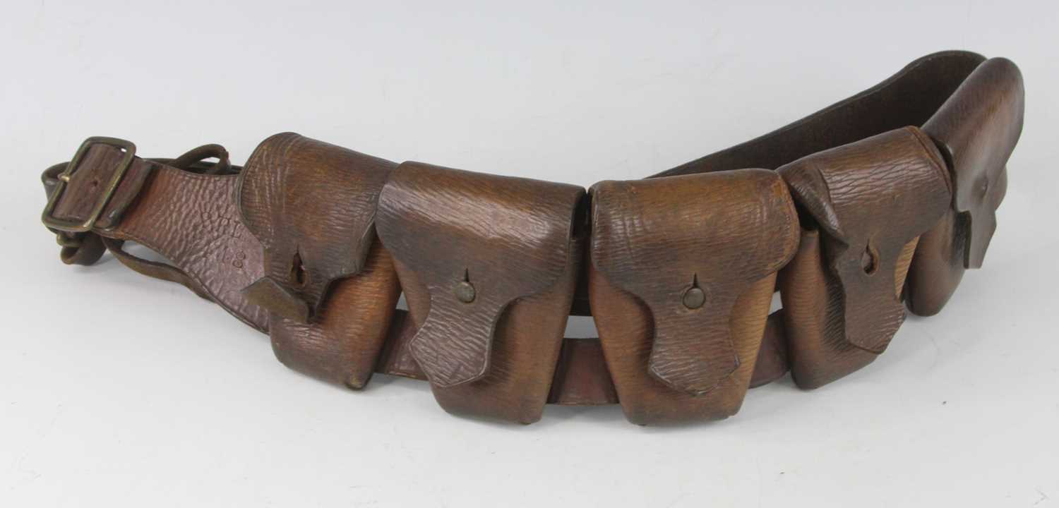 Lot 37 - A WW I brown leather bandolier, stamped...