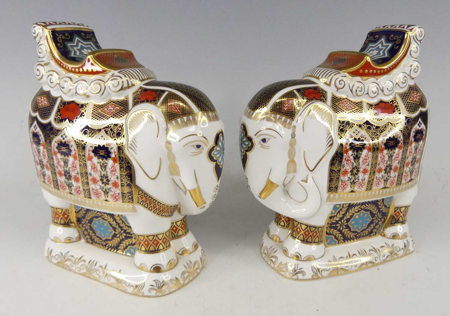 Lot 2024 - A pair of Royal Crown Derby elephants, each...
