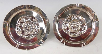 Lot 563 - A pair of circa 1900 silver circular ashtrays,...
