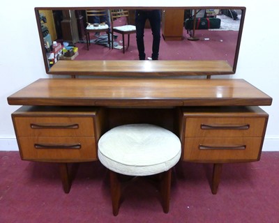 Lot 781 - A 1960s G-Plan 'Fresco' teak long mirrorback...