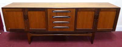 Lot 785 - A 1960s G-Plan 'Fresco' teak long sideboard,...