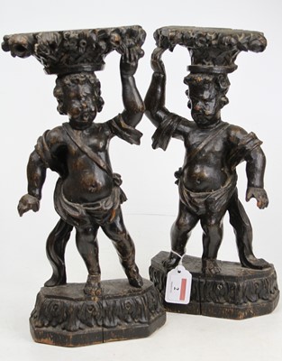 Lot 2 - A pair of 19th century carved wood putti, each...