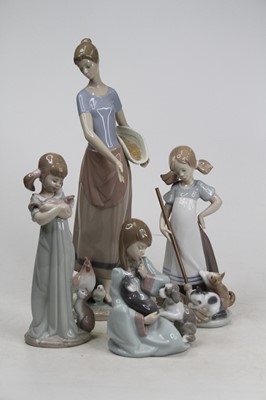 Lot 3 - A collection of four Lladro porcelain figures...