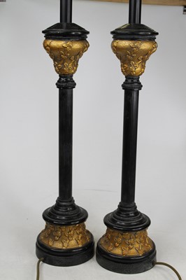 Lot 14 - A pair of modern black and gilt table lamps,...
