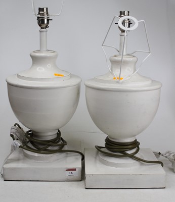 Lot 16 - A pair of white painted wooden table lamps,...