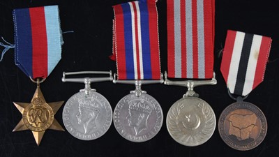 Lot 129 - A collection of medals to include WW II War...