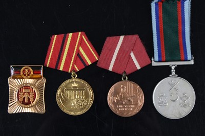 Lot 136 - A collection of three East German medals to...