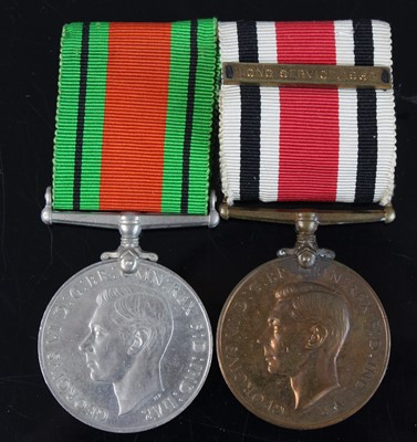 Lot 271 - A WW II Defence medal, together with a...