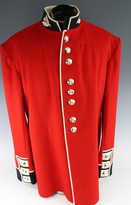 Lot 337 - An Irish Guards dress tunic, in scarlet cloth...