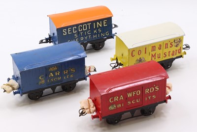 Lot 345 - Four repainted Hornby goods wagons: Carr’s...