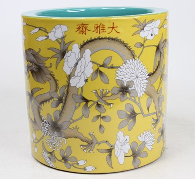 Lot 47 - A Chinese yellow glazed porcelain brush pot,...