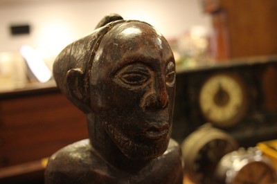 Lot 52 - An African carved hardwood fertility figure,...