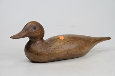Lot 49 - A wood grained metal decoy duck, length 41cm