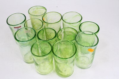 Lot 54 - A set of 12 green glass tumblers, each signed...