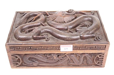 Lot 69 - A Chinese carved hardwood box, decorated with...