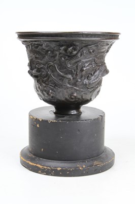 Lot 72 - A Chinese bronzed urn, relief decorated with...