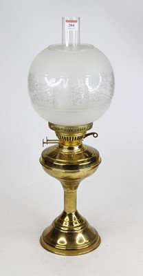 Lot 204 - A brass oil lamp, having an etched glass shade,...