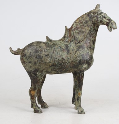 Lot 243 - A reproduction bronzed model of a Tang...