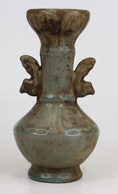 Lot 258 - A Chinese celadon crackle glazed vase, flanked...