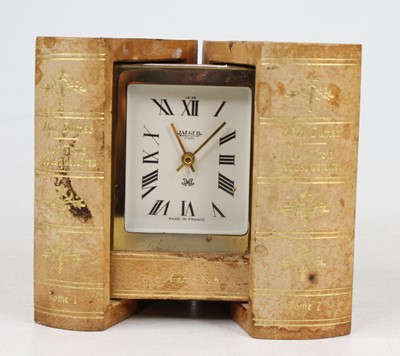 Lot 567 - A Jaeger mystery travel clock disguised behind...