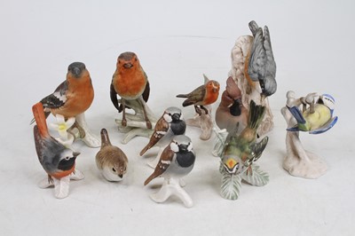 Lot 295 - A collection of W. Goebel china bird ornaments,...