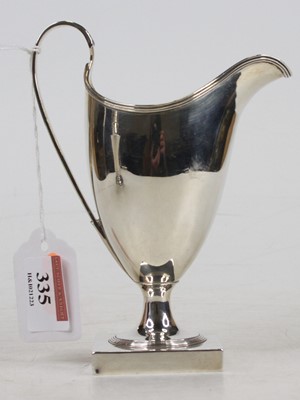 Lot 335 - A George III silver helmet form cream jug,...