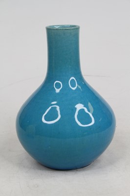 Lot 282 - A blue glazed earthenware vase of baluster...