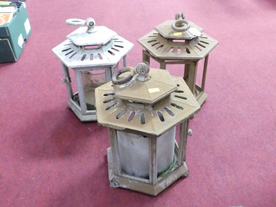 Lot 756 - A set of three iron hanging lanterns, each h.34cm