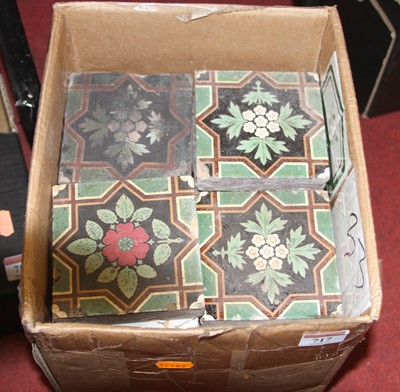 Lot 717 - A set of 33 Minton Hollins floral floor tiles,...