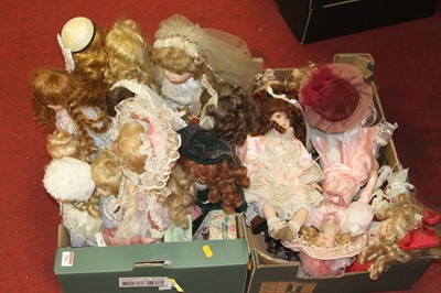 Lot 711 - Two boxes of dolls, to include bisque headed...