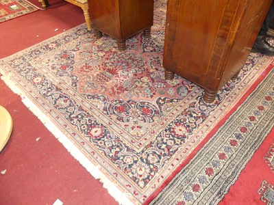 Lot 1176 - A Persian style pink ground machine woven...