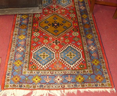 Lot 1180 - A Turkish woollen red ground Oushak rug, 162 x...