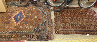 Lot 1182 - A Persian woollen rust ground Shiraz rug, 192...