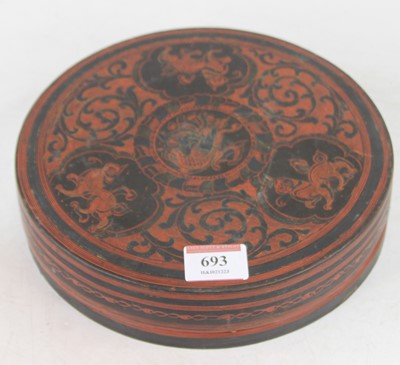 Lot 693 - A Burmese red and black lacquered nut box, dia....