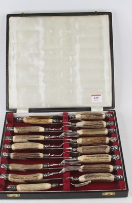 Lot 639 - A cased set of horn handled stainless steel...