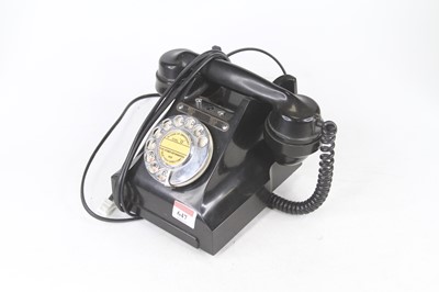 Lot 647 - An early 20th century rotary telephone