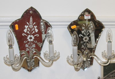 Lot 770 - A pair of vintage mirrored wall lights, each h....