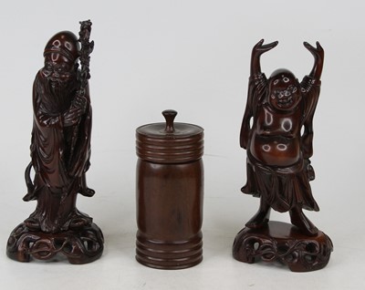 Lot 579 - A Chinese carved hardwood figure of a scholar,...